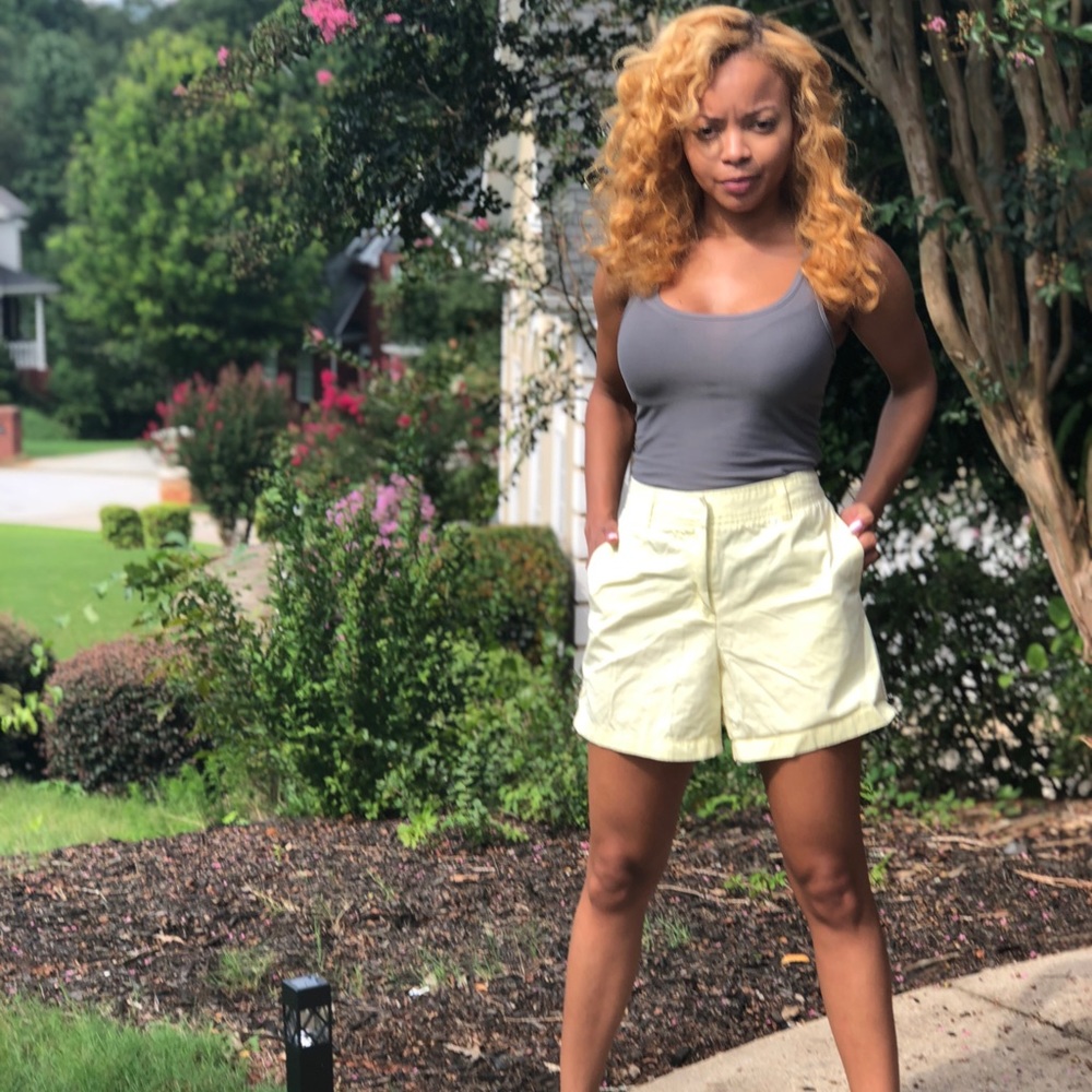 Pale yellow shorts.